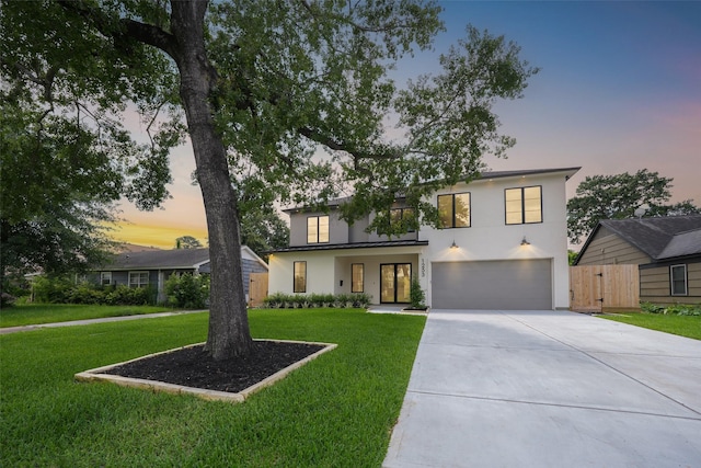 1253 Lamonte Ln, Houston, TX 77018 - contemporary home featuring an attached garage, driveway, and stucco siding