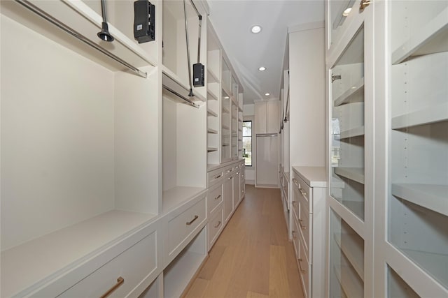 1253 Lamonte Ln, Houston, TX 77018 - walk in closet with light wood-style floors