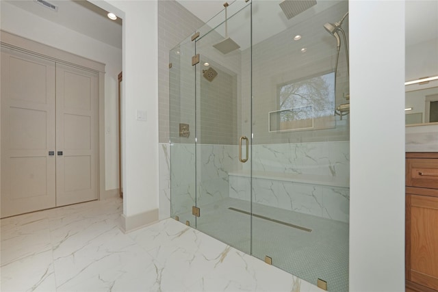 1253 Lamonte Ln, Houston, TX 77018 - bathroom with a marble finish shower, marble finish floors, vanity, and baseboards