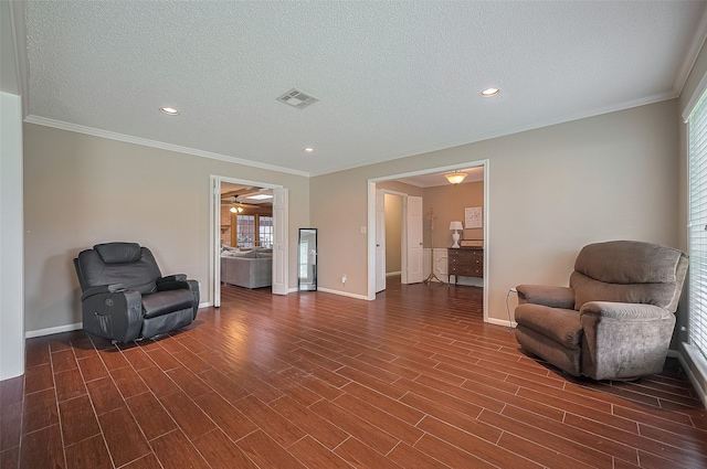 1214 Lindsey Dr, Rosenberg, TX 77471 - sitting room with baseboards, dark wood-style flooring, plenty of natural light, a textured ceiling, and crown molding