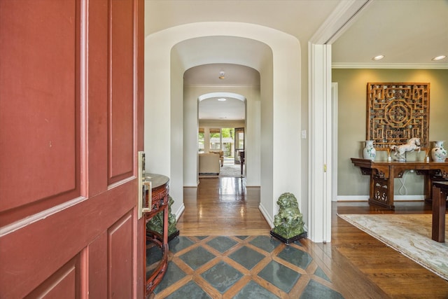 302 Shasta Dr, Houston, TX 77024 - foyer with arched walkways, baseboards, dark wood finished floors, crown molding, and recessed lighting