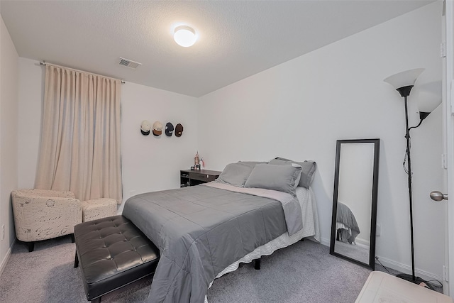 862 Rd 5138, Cleveland, TX 77327 - carpeted bedroom with baseboards and a textured ceiling
