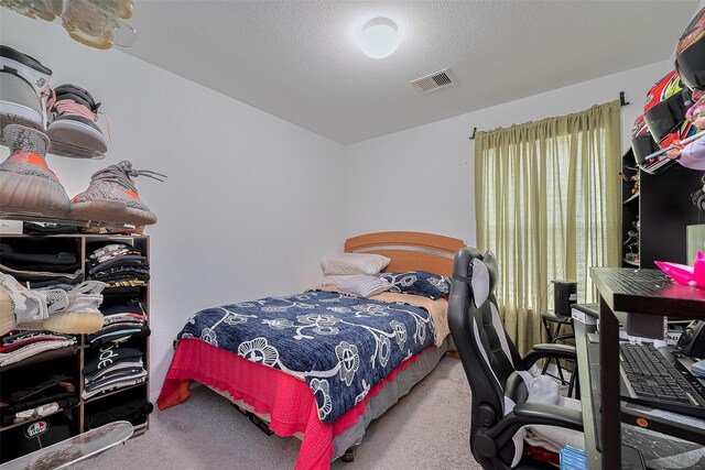 862 Rd 5138, Cleveland, TX 77327 - carpeted bedroom with a textured ceiling