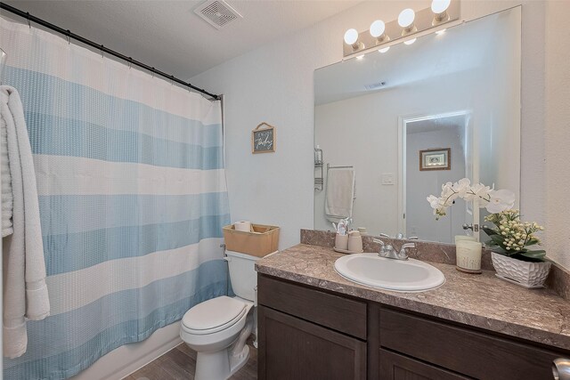 862 Rd 5138, Cleveland, TX 77327 - full bath with vanity, toilet, and wood finished floors