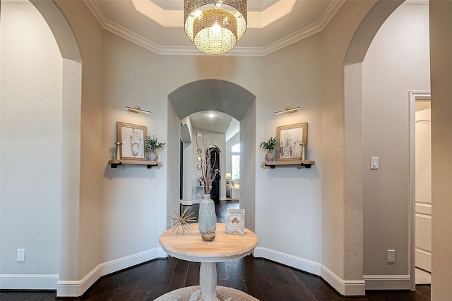 2625 Blooming Field Ln, Conroe, TX 77385 - hall featuring arched walkways, wood finished floors, a chandelier, ornamental molding, and baseboards