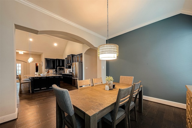 2625 Blooming Field Ln, Conroe, TX 77385 - dining room featuring vaulted ceiling, arched walkways, dark wood-style floors, baseboards, and ornamental molding