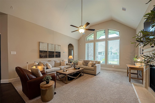 2625 Blooming Field Ln, Conroe, TX 77385 - living room with arched walkways, baseboards, ceiling fan, and high vaulted ceiling