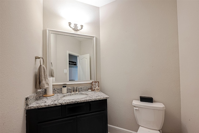 2625 Blooming Field Ln, Conroe, TX 77385 - bathroom featuring vanity and toilet