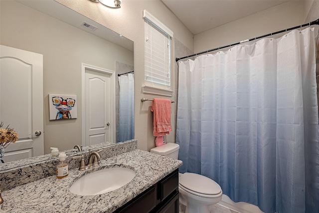 2625 Blooming Field Ln, Conroe, TX 77385 - bathroom featuring toilet, vanity, and a shower with shower curtain
