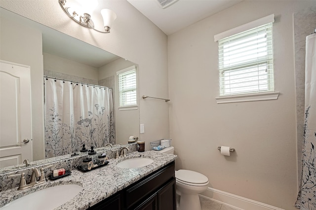 2625 Blooming Field Ln, Conroe, TX 77385 - bathroom with toilet, double vanity, baseboards, tile patterned flooring, and a shower with curtain
