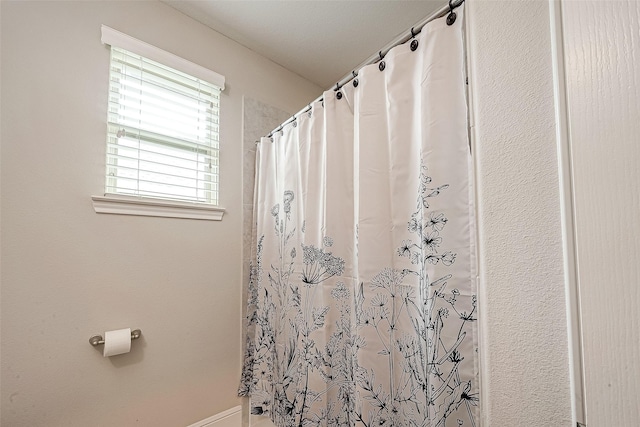 2625 Blooming Field Ln, Conroe, TX 77385 - bathroom featuring a shower with curtain
