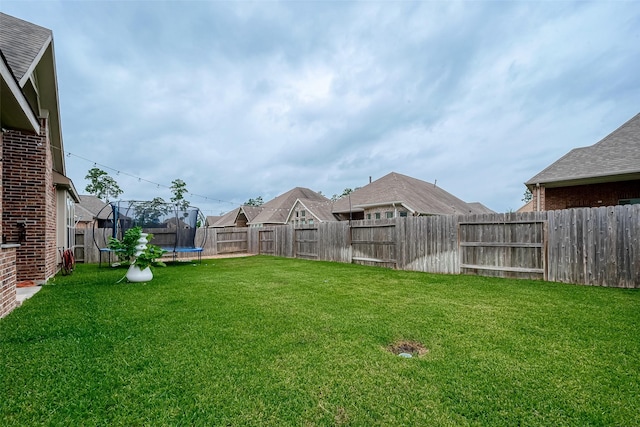 2625 Blooming Field Ln, Conroe, TX 77385 - view of yard with a trampoline