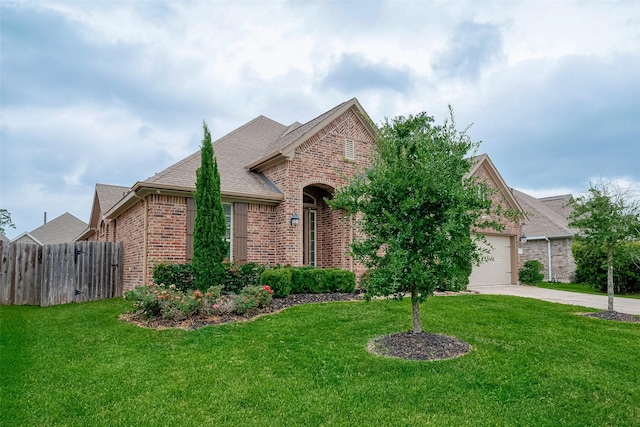 2625 Blooming Field Ln, Conroe, TX 77385 - view of front of house featuring brick siding, driveway, roof with shingles, and an attached garage