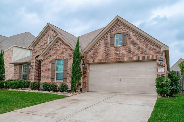 2625 Blooming Field Ln, Conroe, TX 77385 - traditional home with brick siding, concrete driveway, roof with shingles, and a front yard