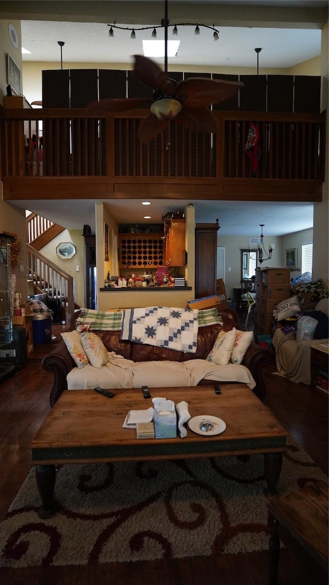 7355 Birchtree Forest Dr, Houston, TX 77088 - living area with wood finished floors, a towering ceiling, and stairway