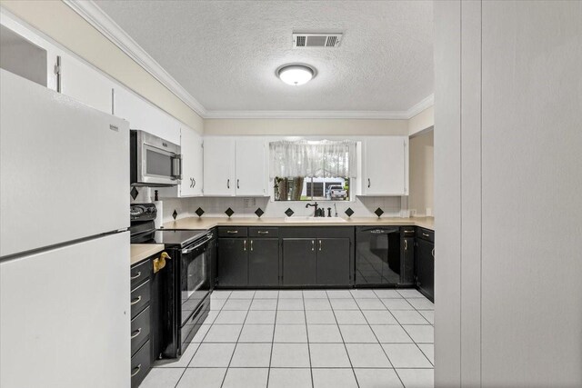 309 Helen Dr, Deer Park, TX 77536 - kitchen with black appliances, white cabinets, dark cabinets, light countertops, and crown molding