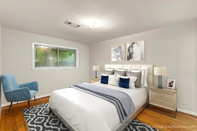 309 Helen Dr, Deer Park, TX 77536 - bedroom with baseboards and wood finished floors