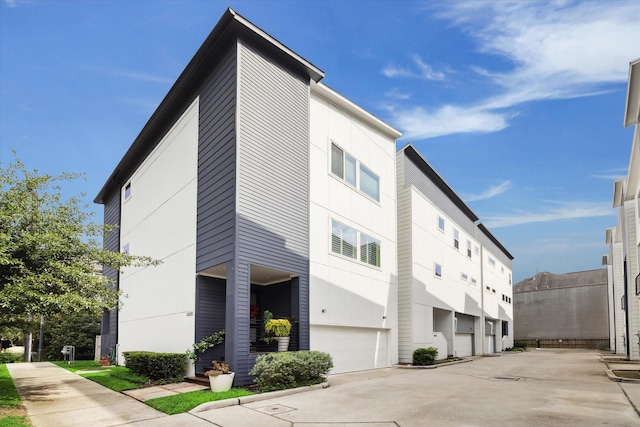 1234 W 25th St Unit A, Houston, TX 77008 - view of building exterior with a garage