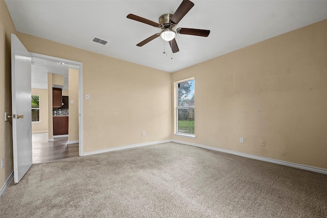 6639 Feather Creek Dr, Houston, TX 77086 - carpeted spare room featuring ceiling fan and baseboards