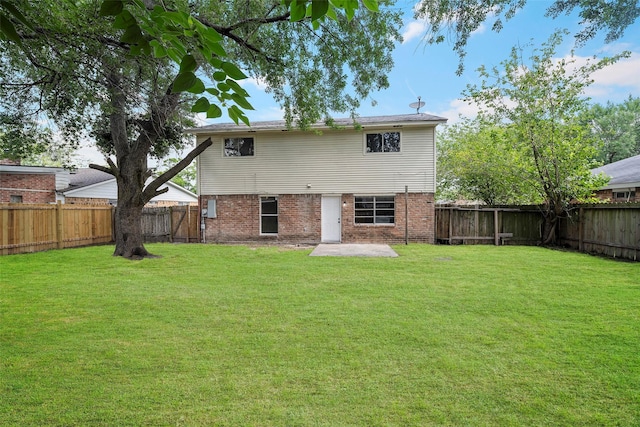 6639 Feather Creek Dr, Houston, TX 77086 - rear view of property with brick siding and a patio area