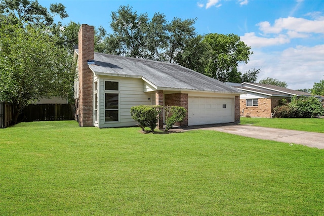 6639 Feather Creek Dr, Houston, TX 77086 - view of front facade with driveway, a garage, a chimney, and brick siding