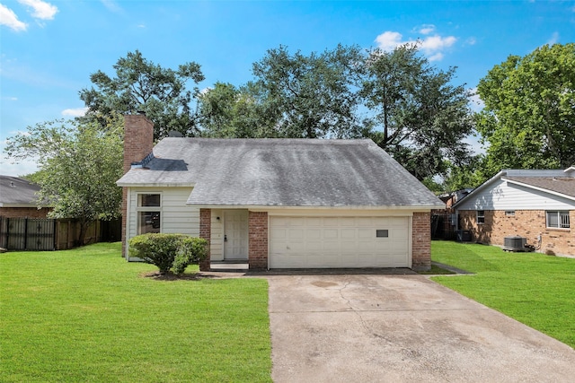 6639 Feather Creek Dr, Houston, TX 77086 - view of front of home with brick siding, a chimney, concrete driveway, and central air condition unit
