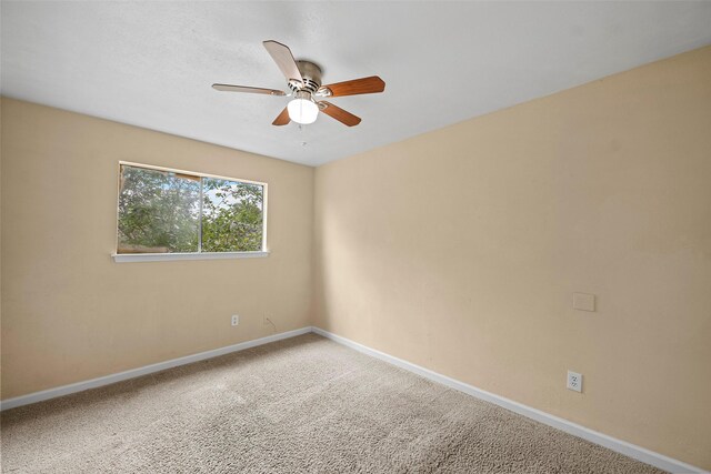 6639 Feather Creek Dr, Houston, TX 77086 - carpeted empty room featuring a ceiling fan and baseboards