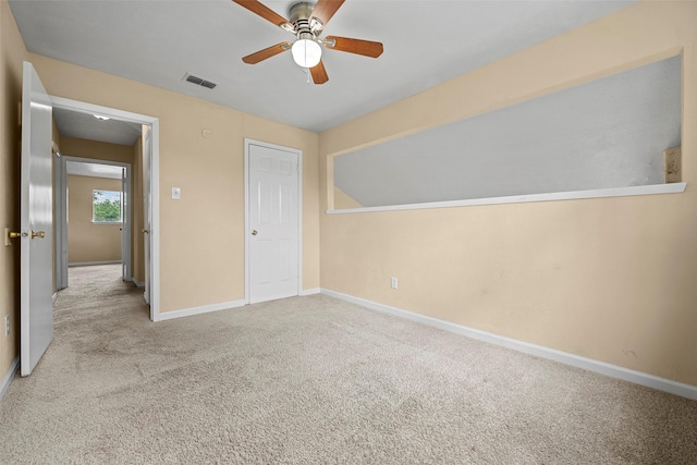 6639 Feather Creek Dr, Houston, TX 77086 - unfurnished bedroom featuring carpet, baseboards, and a ceiling fan