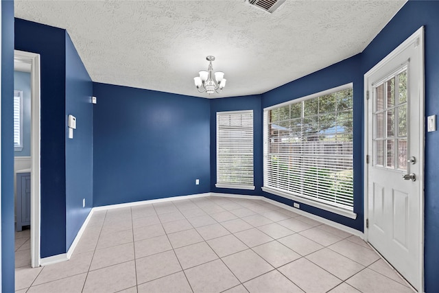 4131 N New Meadows Dr, Sugar Land, TX 77479 - tiled empty room featuring a chandelier, a textured ceiling, and baseboards