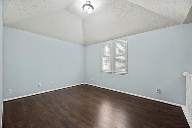 4131 N New Meadows Dr, Sugar Land, TX 77479 - spare room with lofted ceiling, wood finished floors, a textured ceiling, and baseboards