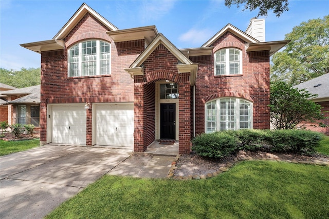 4131 N New Meadows Dr, Sugar Land, TX 77479 - view of front of house featuring brick siding, a chimney, an attached garage, and driveway