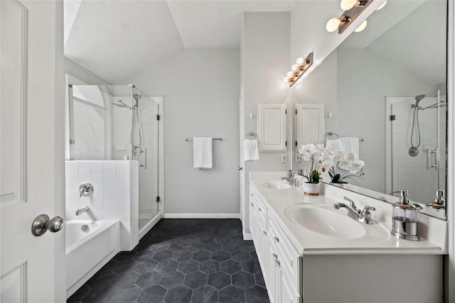 4131 N New Meadows Dr, Sugar Land, TX 77479 - full bathroom featuring lofted ceiling, a bath, a shower stall, double vanity, and a textured ceiling