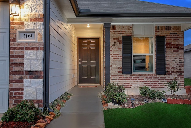 309 Cumberland Forest Dr, Magnolia, TX 77354 - doorway to property with brick siding