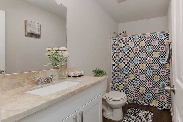 309 Cumberland Forest Dr, Magnolia, TX 77354 - full bath featuring vanity, wood finished floors, toilet, and curtained shower