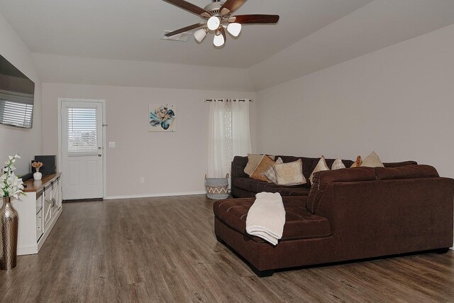 309 Cumberland Forest Dr, Magnolia, TX 77354 - living area with dark wood finished floors, a ceiling fan, baseboards, and vaulted ceiling