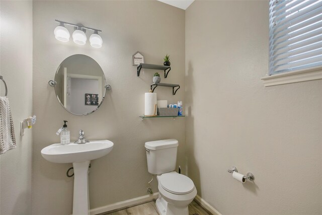 5732 Montclair Hill Ln, Rosharon, TX 77583 - half bathroom with toilet and wood finished floors