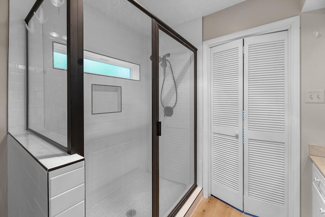 457 Monticello Park, Conroe, TX 77302 - full bathroom with a stall shower, a closet, and vanity