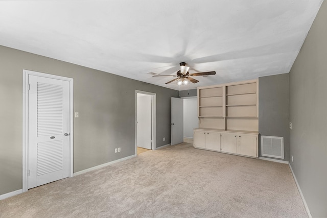 457 Monticello Park, Conroe, TX 77302 - unfurnished bedroom featuring light colored carpet, baseboards, and ceiling fan