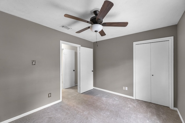 457 Monticello Park, Conroe, TX 77302 - unfurnished bedroom with carpet floors, baseboards, a closet, and a ceiling fan