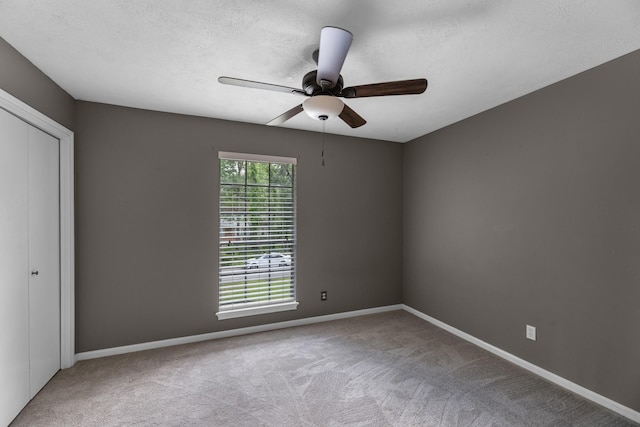 457 Monticello Park, Conroe, TX 77302 - carpeted spare room with ceiling fan, baseboards, and a textured ceiling