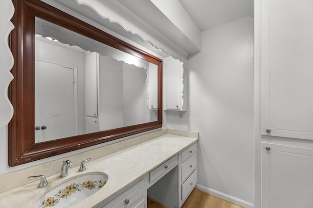 457 Monticello Park, Conroe, TX 77302 - bathroom with vanity, wood finished floors, and baseboards