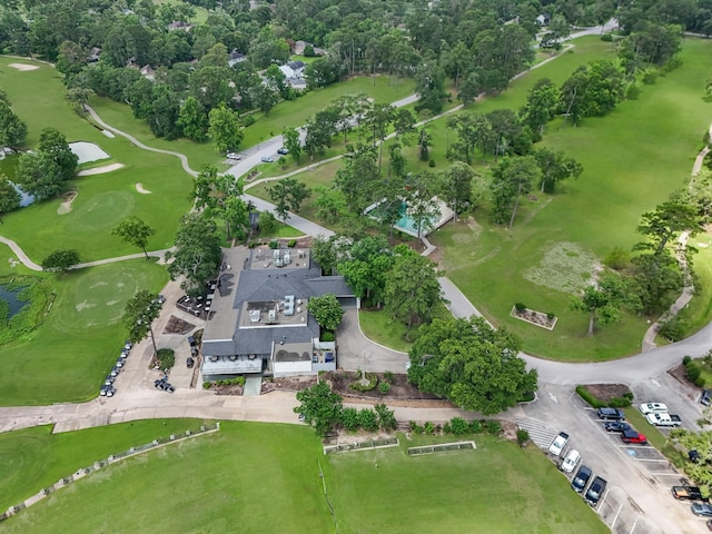 457 Monticello Park, Conroe, TX 77302 - bird's eye view of a golf club, a tree filled landscape, and a large body of water