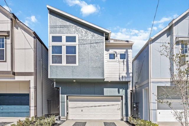 1108 Dart St, Houston, TX 77007 - view of front facade with an attached garage and driveway