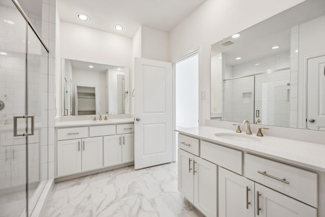 1108 Dart St, Houston, TX 77007 - bathroom featuring a shower stall, two vanities, marble look tile flooring, and recessed lighting