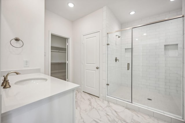 1108 Dart St, Houston, TX 77007 - bathroom featuring a shower stall, vanity, marble look tiles, recessed lighting, and a walk in closet