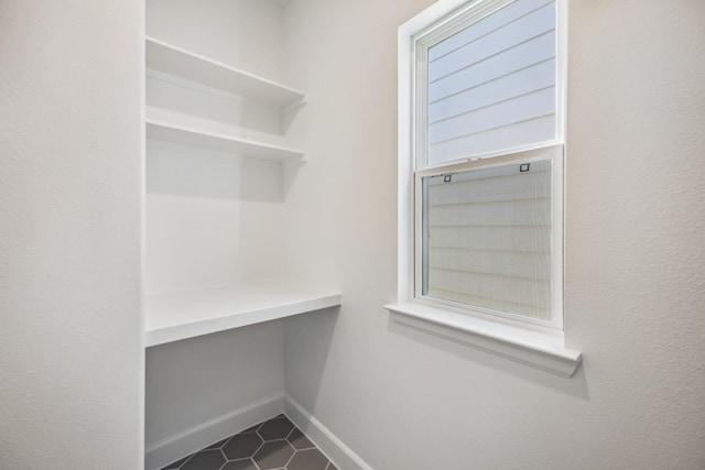 1108 Dart St, Houston, TX 77007 - spacious closet with dark tile patterned flooring