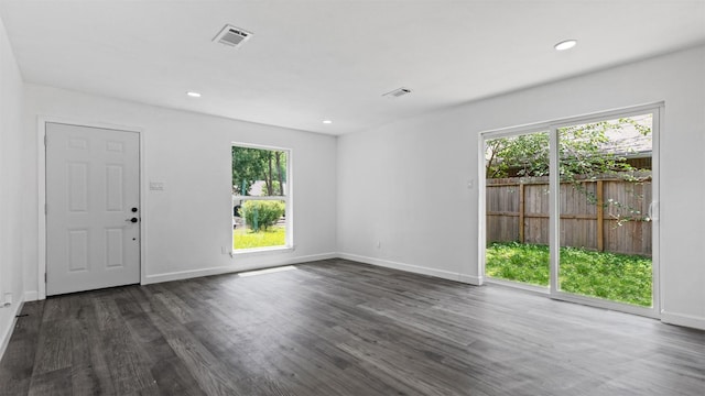 8603 Twisting Vine Ln, Houston, TX 77040 - spare room with healthy amount of natural light, dark wood-type flooring, baseboards, and recessed lighting