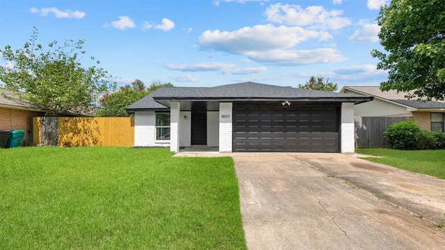 8603 Twisting Vine Ln, Houston, TX 77040 - view of front of house with brick siding, concrete driveway, an attached garage, and roof with shingles