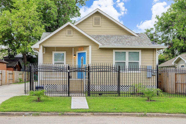 7112 Ave L, Houston, TX 77011 - view of front of property with a fenced front yard and a shingled roof