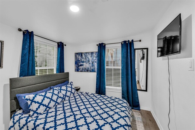 7112 Ave L, Houston, TX 77011 - bedroom featuring wood finished floors and baseboards